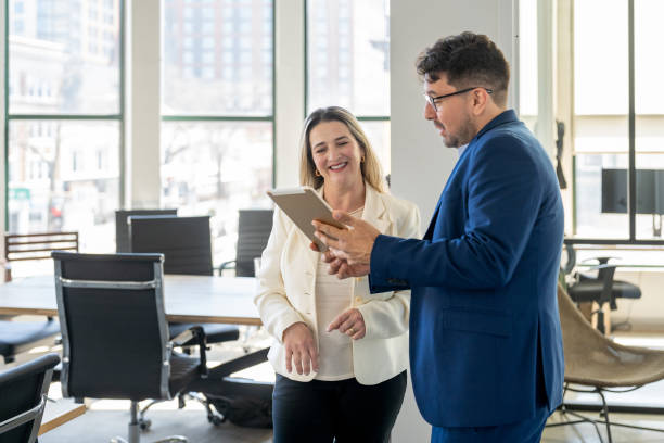 istock Professional consultant and a client interacting in the office 2146860438