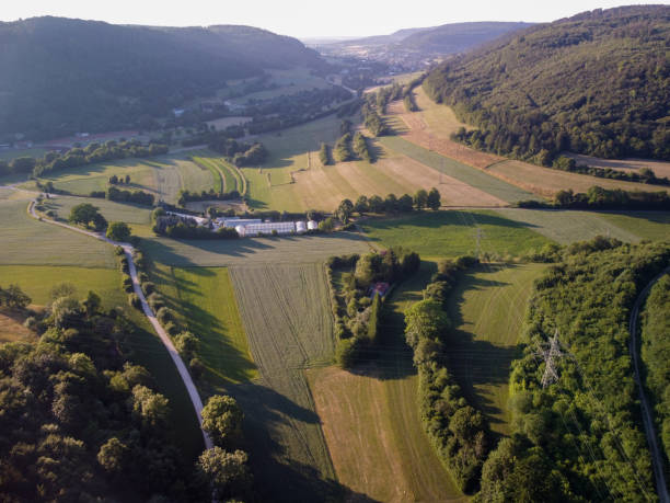 istock Aerial view on small town - colorful fields and trees in autumn 2146871381
