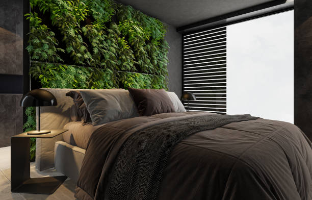 istock Modern minimalist bedroom with double bed and vertical garden on wall 2146940584