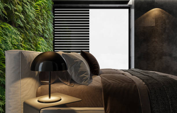 istock Modern minimalist bedroom with double bed and vertical garden on wall 2146942649