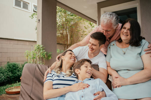 istock Multigenerational family in a moment of affection on the balcony 2147034310
