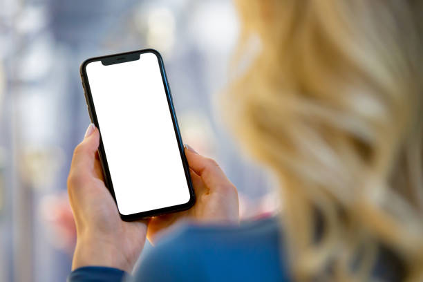 istock Digital Canvas: Woman's Hand Holding Smartphone with Blank Screen 2147034314
