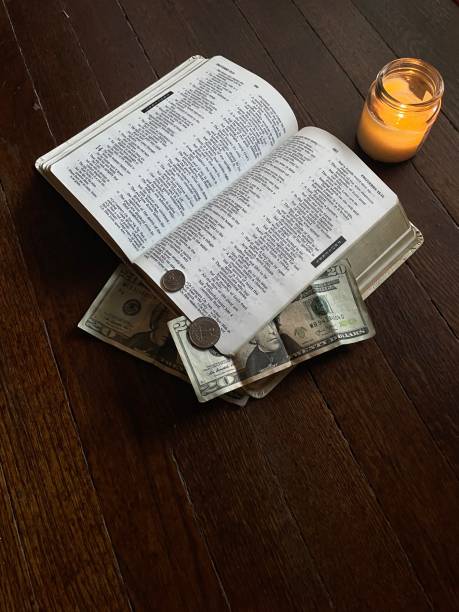 istock money and bible, 2147043698