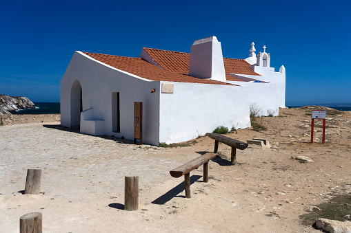 Baleal, Portugal - August 27, 2023: Typical white Chapel of Santo Estevao do Baleal in the Baleal island, Peniche, Portugal, in a sunny day.