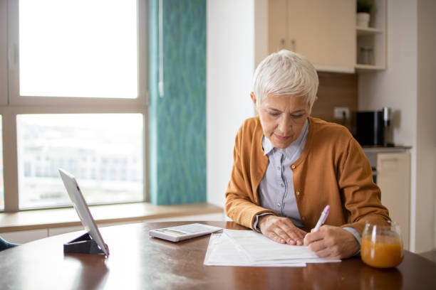 istock Woman is going through household finances 2147082586
