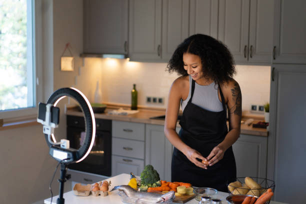 istock Beautiful chef live streaming cookery show 2147096780