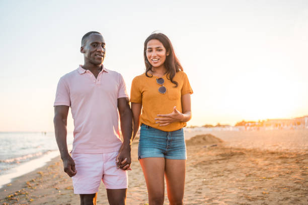 istock Sunny Seaside Romance For A Handsome Young Multiracial Couple 2147100646