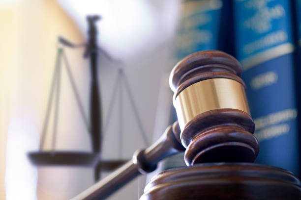 istock Gavel In Front Of Law Books And Justice Scale 2147107471