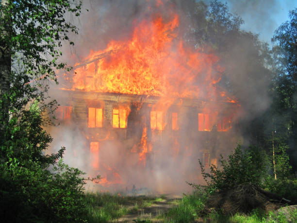 istock Burning house. Big wooden building completely destroyed by fire 2147125875