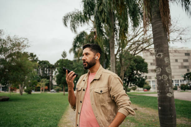 istock Latino man using cell phone outdoors 2147126918