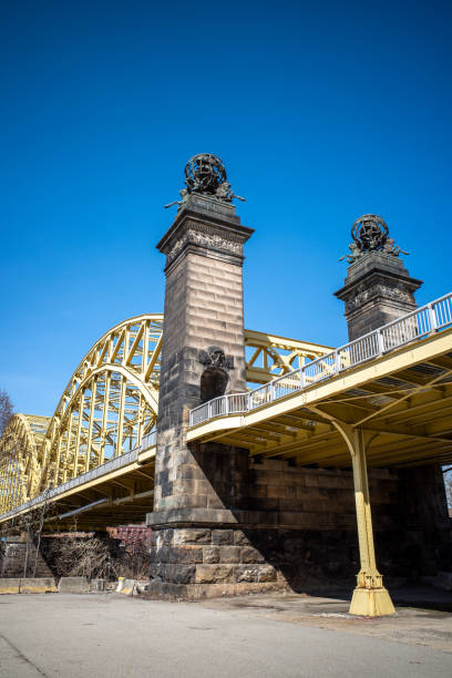 Construction frame on a bridge with a blue sky in the background.
