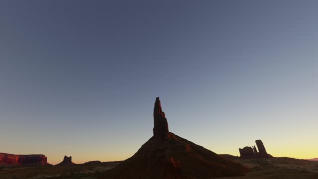 Aerial view at sunset of the desert at Big Indian Chief monolith in Monument Valley in Arizona. United States