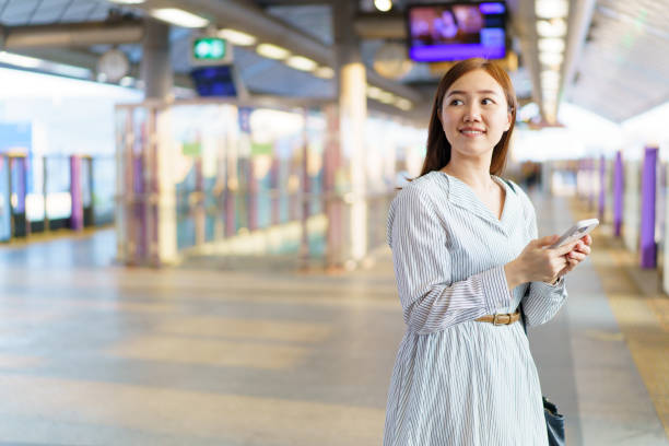 istock Businesswoman using smartphone while traveling on a train. 2147257213