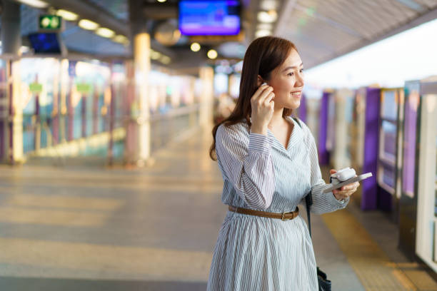 istock Businesswoman using smartphone while traveling on a train. 2147257220