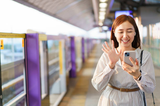 istock Businesswoman using smartphone while traveling on a train. 2147258248