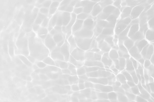istock Bluewater waves on the surface ripples blurred. Defocus blurred transparent blue colored clear calm water surface texture with splash and bubbles. Water waves with shining pattern texture background. 2147355780