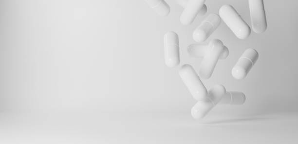 istock 3D Illustration.Lots of white capsules on white background. Tablets.Copy space. (horizontal) 2147388708