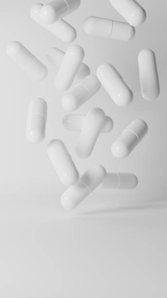 istock 3D Illustration.Lots of white capsules on white background. Tablets.(Vertical) 2147388710