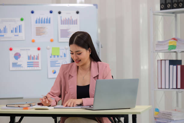 istock Business accounting woman counting on calculator working on financial document in hands closeup. Bookkeeping concept 2147405948
