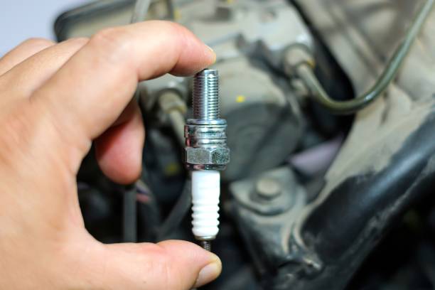 istock New part of spark plug for change with concept maintenance and installation. 2147405967