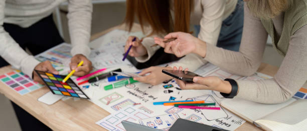 istock Brainstorm team of creative web graphic designer planning, Group of mobile phone app developer team meeting for share ideas about screen prototype layout for smartphone. startup planning ui and ux 2147411791