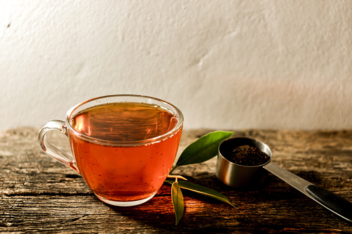 Put hot tea on old wooden.concept photo of beverage.