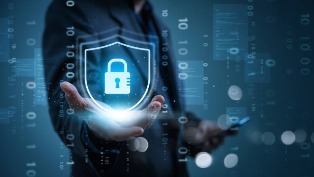 istock Cyber security and data protection. Businessman holding padlock protecting  business and financial transaction data from cyber attack, user private data security encryption. 2147434978