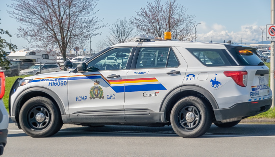 Vancouver, British Columbia, Canada. Apr 6, 2024. A side view of a RCMP or Royal Canadian Mounted Police vehicle.