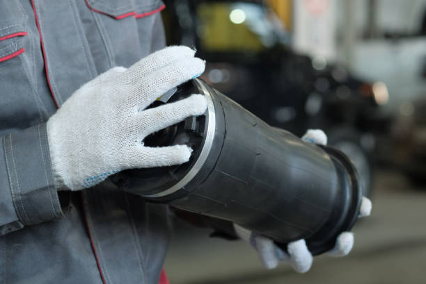 A new pneumatic cylinder. An auto mechanic monitors the serviceability and integrity of the pneumatic cylinder before replacing it.