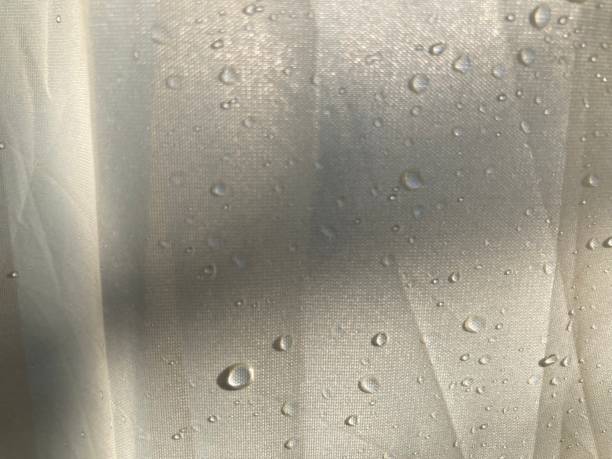 istock dew drops on the white canvas and shadow from the morning sun 2147489186