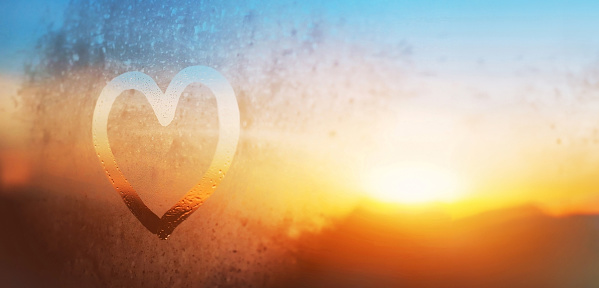 love, kindness and care, heart drawn on the window glass, banner background with copyspace