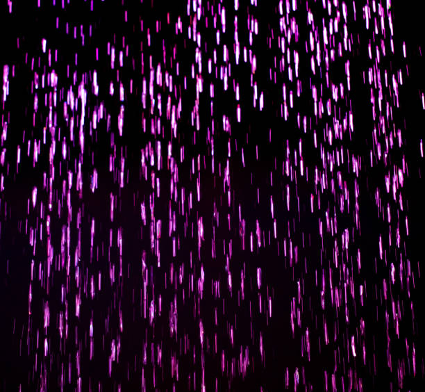istock Drops of pink rain on a black background 2147491571