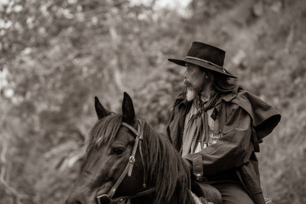 istock Sepia tone action cowboy portrait. 2147492402