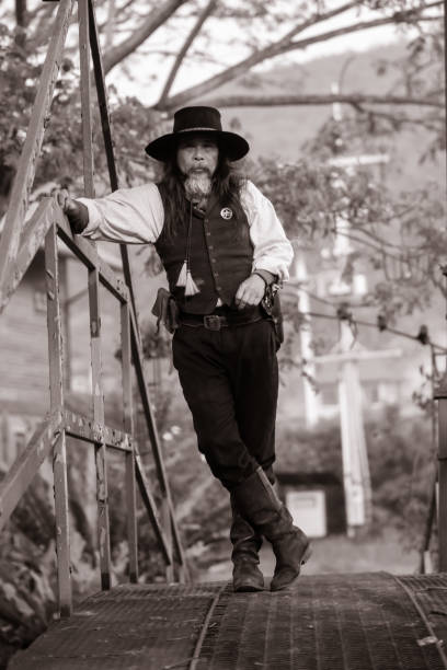 istock Sepia tone action cowboy portrait. 2147492442