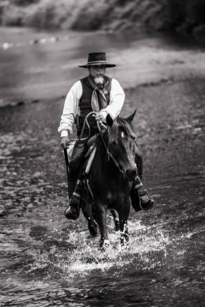 istock Sepia tone action cowboy portrait. 2147492473