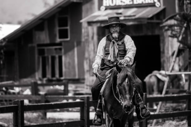 istock Sepia tone action cowboy portrait. 2147492489