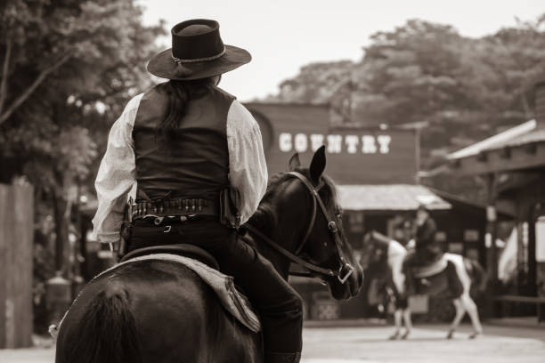 istock Sepia tone action cowboy portrait. 2147492495