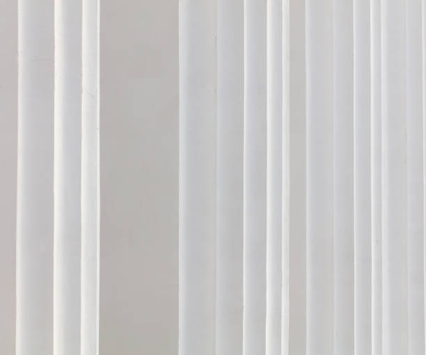 istock White curtain texture for background with copy space for text or image. Walls of the building 2147493508