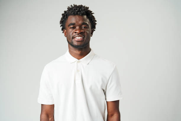 istock Smiling Man in White Polo Shirt 2147494634
