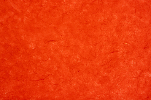Red color mulberry paper texture as background.