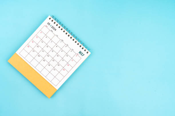 istock 2024 May Desk Calendar On Blue Background. 2147496715