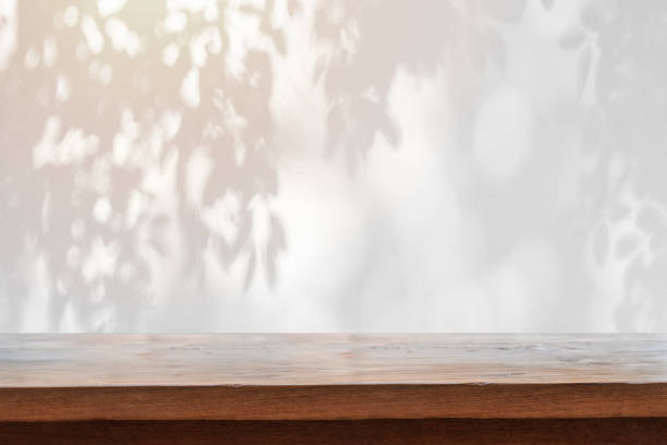 istock Abstract black and white Shadow of leaves background and textured with empty table top 2147497626