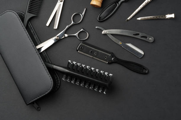 istock Variety of Hair Styling Tools and Accessories Displayed on a Dark Background 2147499087