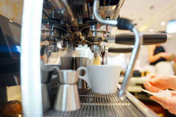 istock Preparing Espresso in a Modern Cafe During Busy Morning Hours 2147499507