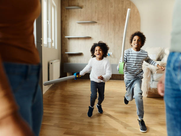 istock Happy black kids having fun after moving into a new apartment. 2147500399