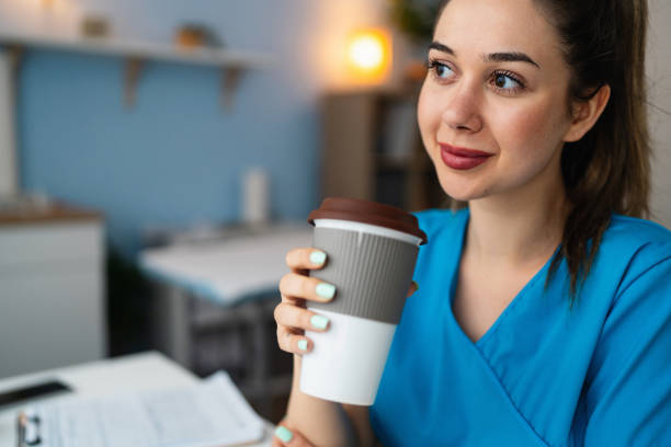 istock Female doctor having a coffee break at the ordination 2147500492