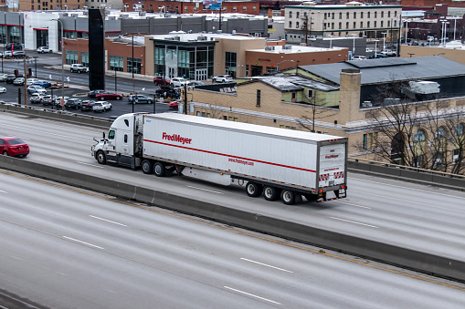 Spokane, Washington USA
March 2, 2022
Market Express, a contracted trucking company, pulling a semi-trailer for Kroger subsidiary Fred Meyer Stores through the downtown city center of Spokane, Washington USA on Interstate 90.