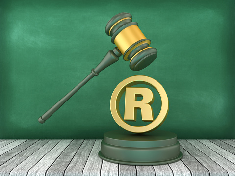 Legal Gavel with Registered Trademark - Chalkboard Background - 3D Rendering