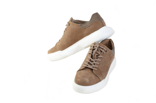 istock Pair of comfortable suede shoes on white background 2147503111