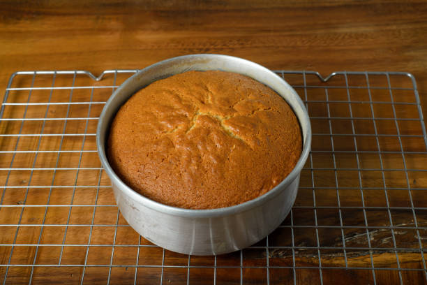 istock Freshly baked sponge cake cooling on wooden table. 2147505122